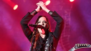Lzzy Hale onstage with Halestorm in 2023