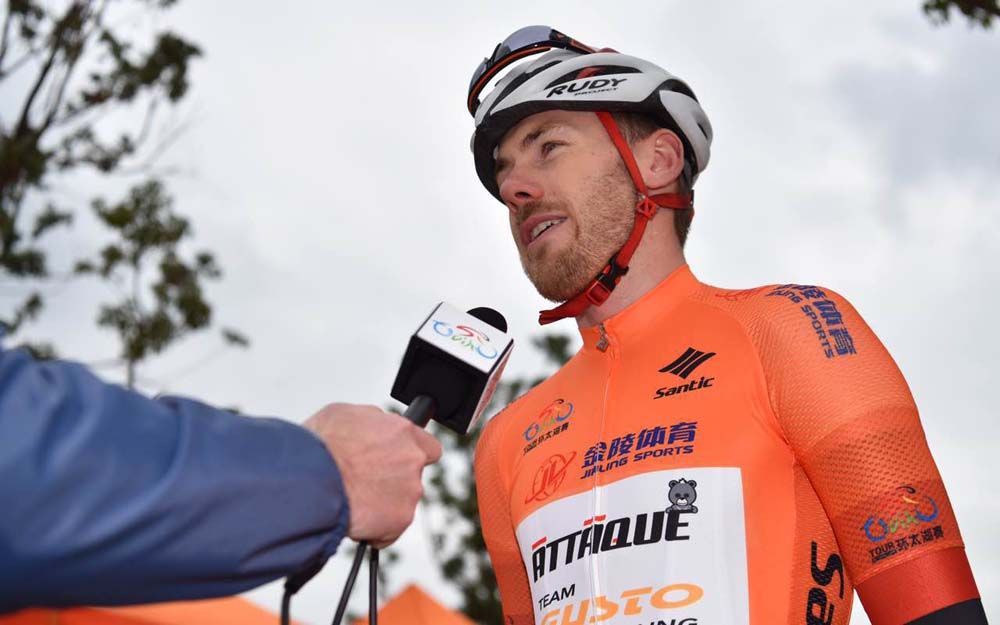 Cameron Bayly in the leader's orange jersey