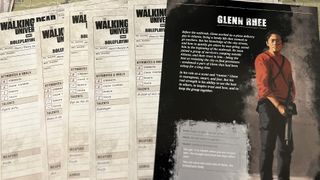Image of character sheets from The Walking Dead RPG, Glenn Rhee features in the front