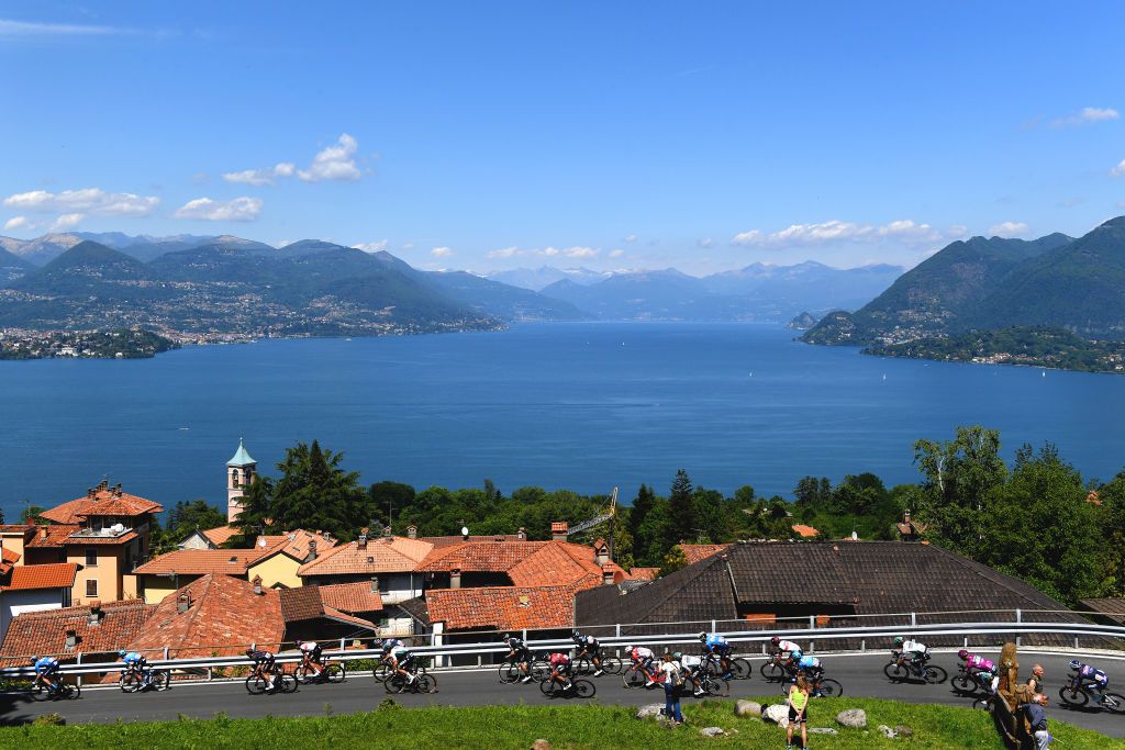ALPE DI MERA VALSESIA ITALY MAY 28 Salvatore Puccio of Italy and Team INEOS Grenadiers Peter Sagan of Slovakia and Team Bora Hansgrohe Purple Points Jersey The peloton passing through Stresa Village landscape during the 104th Giro dItalia 2021 Stage 19 a 166km stage from Abbiategrasso to Alpe di Mera Valsesia 1531m Maggiore Lake Public Fans Stage modified due to the tragic events on May the 23rd 2021 that involved the Mottarone Cableway UCIworldtour girodiitalia Giro on May 28 2021 in Alpe di Mera Valsesia Italy Photo by Tim de WaeleGetty Images
