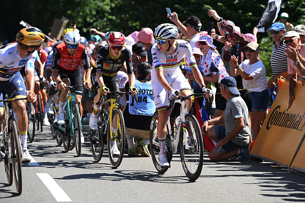Remco Evenepoel and Tadej Pogacar watch their rivals