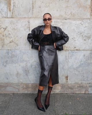 European autumn fashion trends: @ingridedvinsen wears a leather skirt and sheer socks