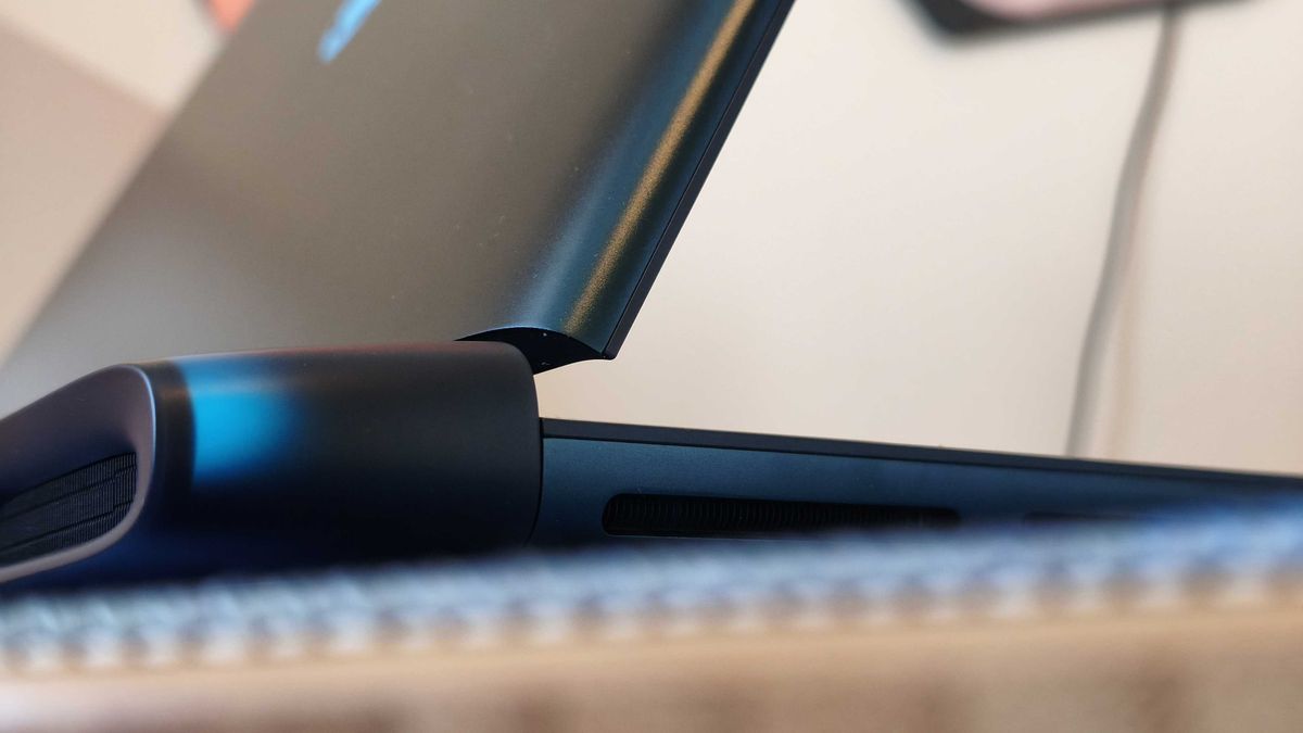 An Alienware 16 Area-51 laptop on a wooden desk