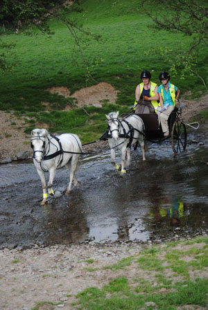 Sian Burrows demonstrating ford crossing in a tandem