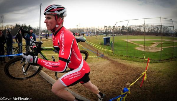 Dylan McNicholas (Cyclocrossworld.com) running barriers in front of the baseball field