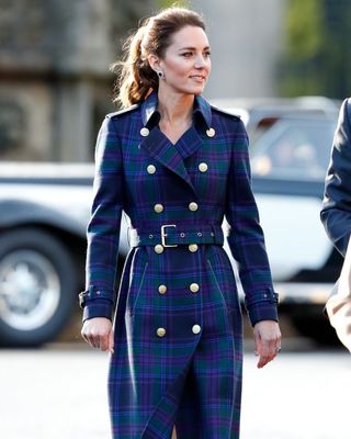 Kate Middleton wearing a long blue checked coat