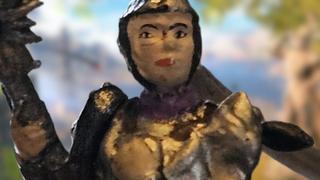 A Shadowheart miniature with a melty face.