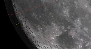 A closeup of the moon's surface showing a many craters