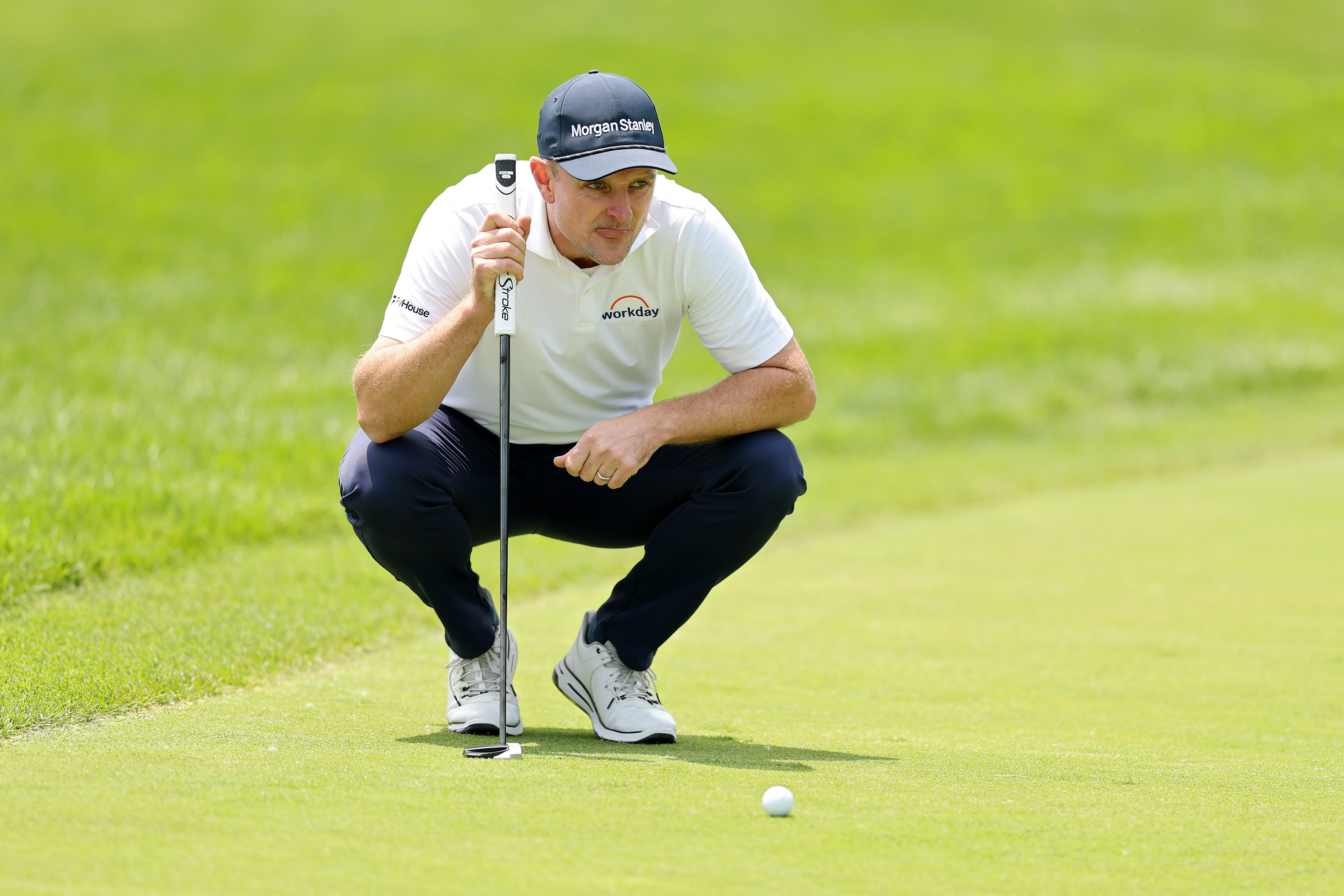 Justin Rose lines up a putt