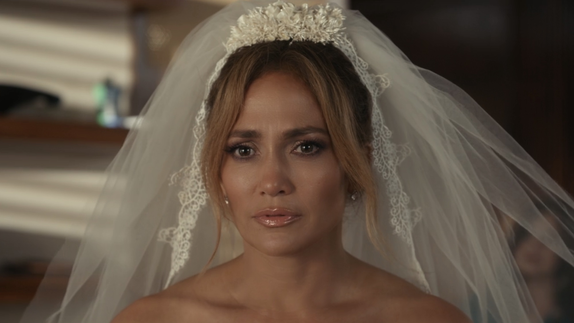 JLo in a wedding dress in Shotgun Wedding.