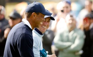 Tiger Woods and Justin Thomas laugh