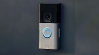 Ring doorbell camera mounted to a dark surface