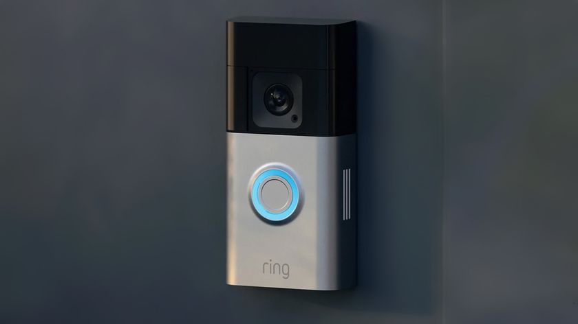 Ring doorbell camera mounted to a dark surface