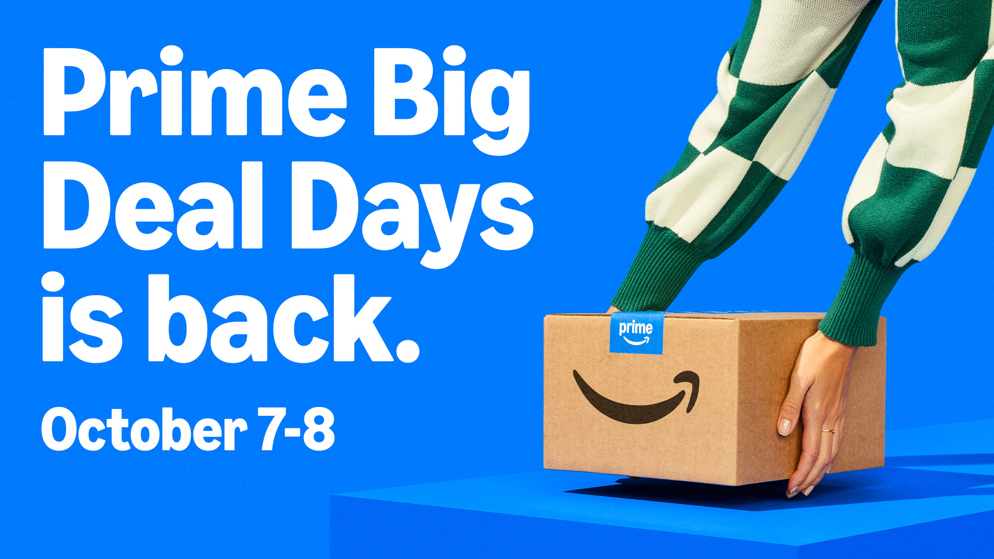 A woman setting a package down on a blue table beside text reading &quot;Prime Big Deal Days is back. October 7-8.&quot;