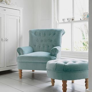 blue button velvet armchair