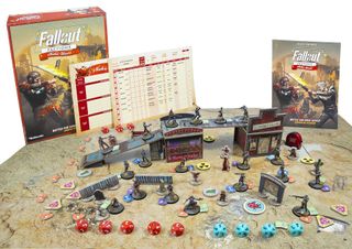 The contents of the Fallout: Factions starter set arranged for a game.