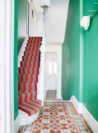 Entryway ideas with green walls and floor tiles
