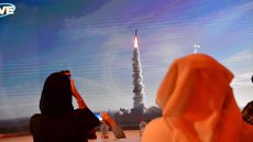 A picture taken on July 19, 2020, shows a screen broadcasting the launch of the "Hope" Mars probe at the Mohammed Bin Rashid Space Center in Dubai.