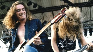Cliff Burton and James Hetfield performing with Metallica in 1985