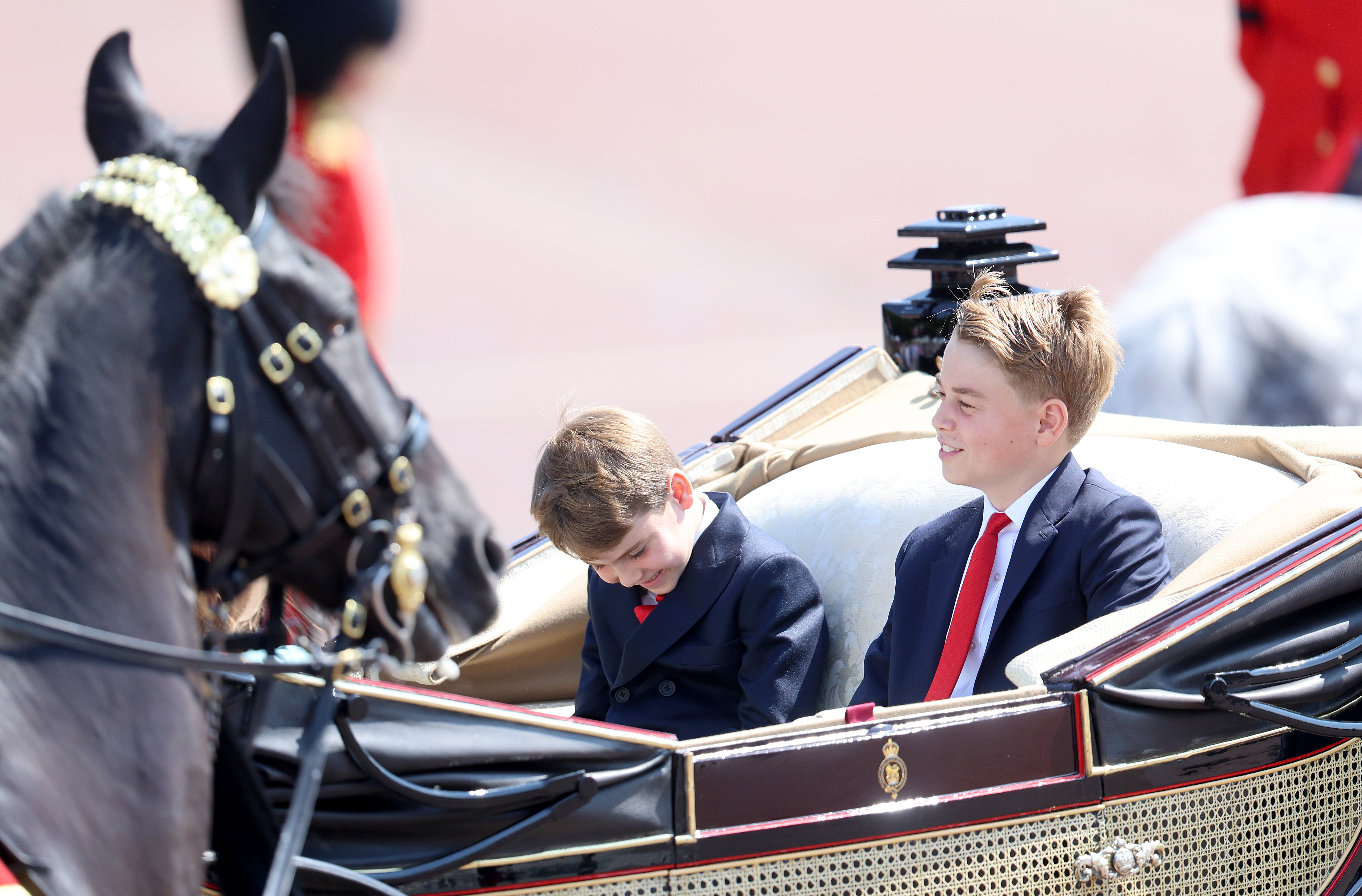 Prince Louis and Prince George laughing in the carriage as they arrive at Trooping the Colour 2025