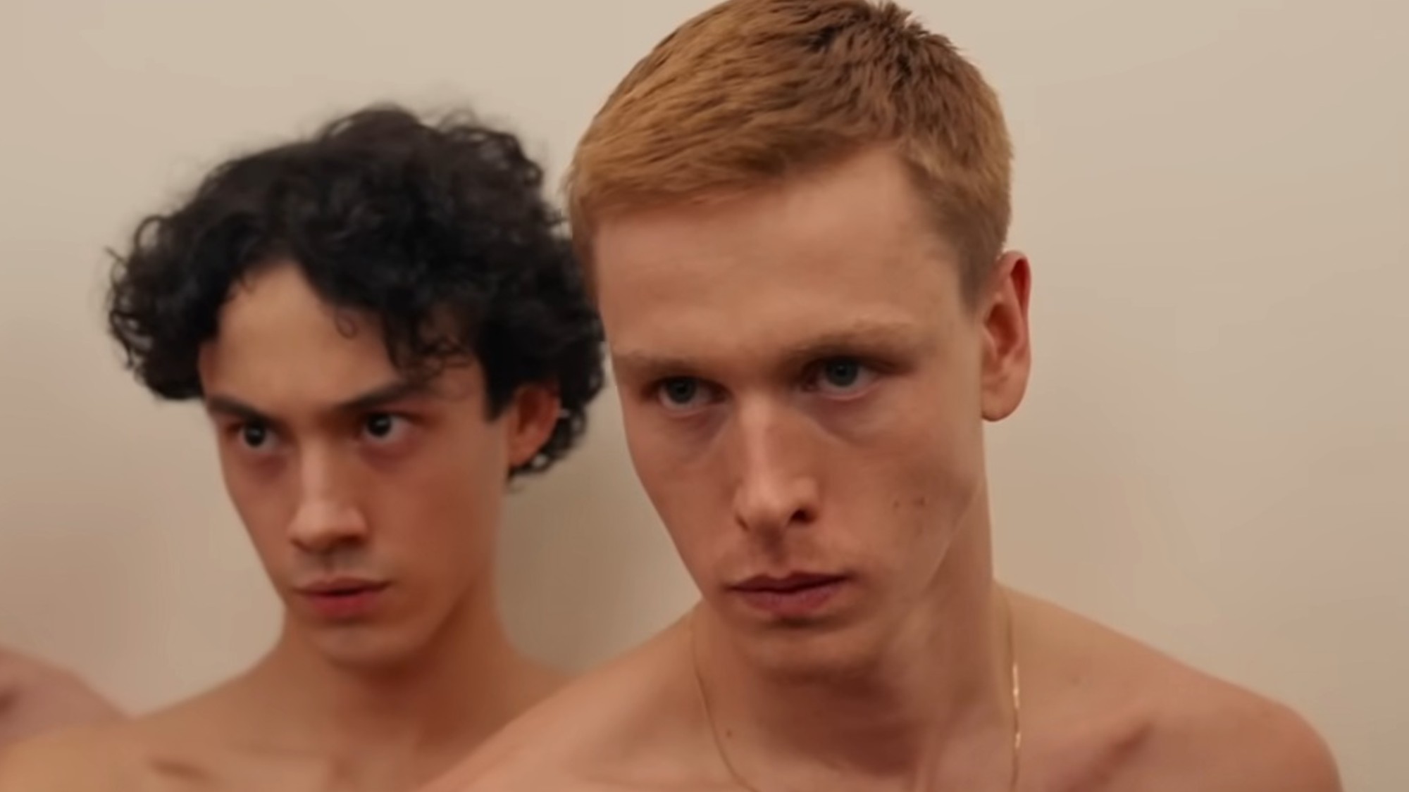 Harris Dickinson and another giving their best serious look in Triangle of Sadness
