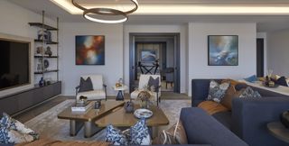 Modern designed living room with hints of blue, cream and orange