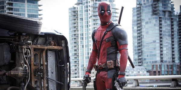 Deadpool holding guns on highway