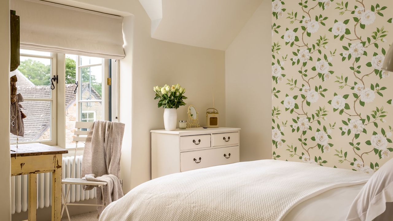 bedroom with floral wallpaper