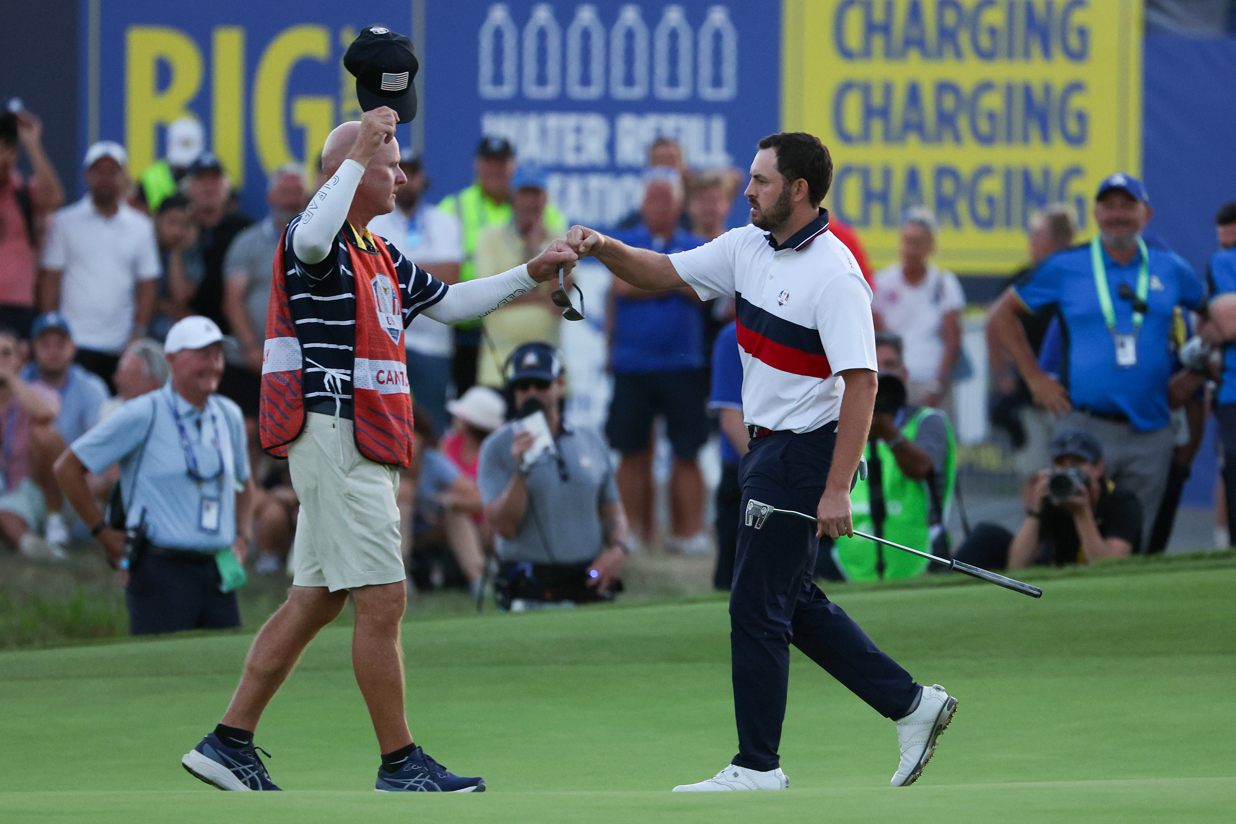 Joe LaCava and Patrick Cantlay fist pump