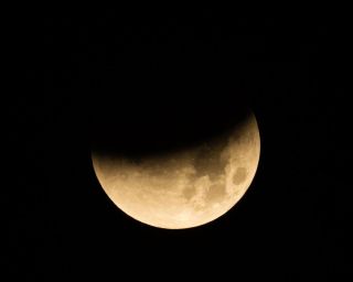 A lunar eclipse before it turned into a "blood moon" photographed from the Johnson Space Center in Houston, Texas in the early morning of Jan. 31, 2018.