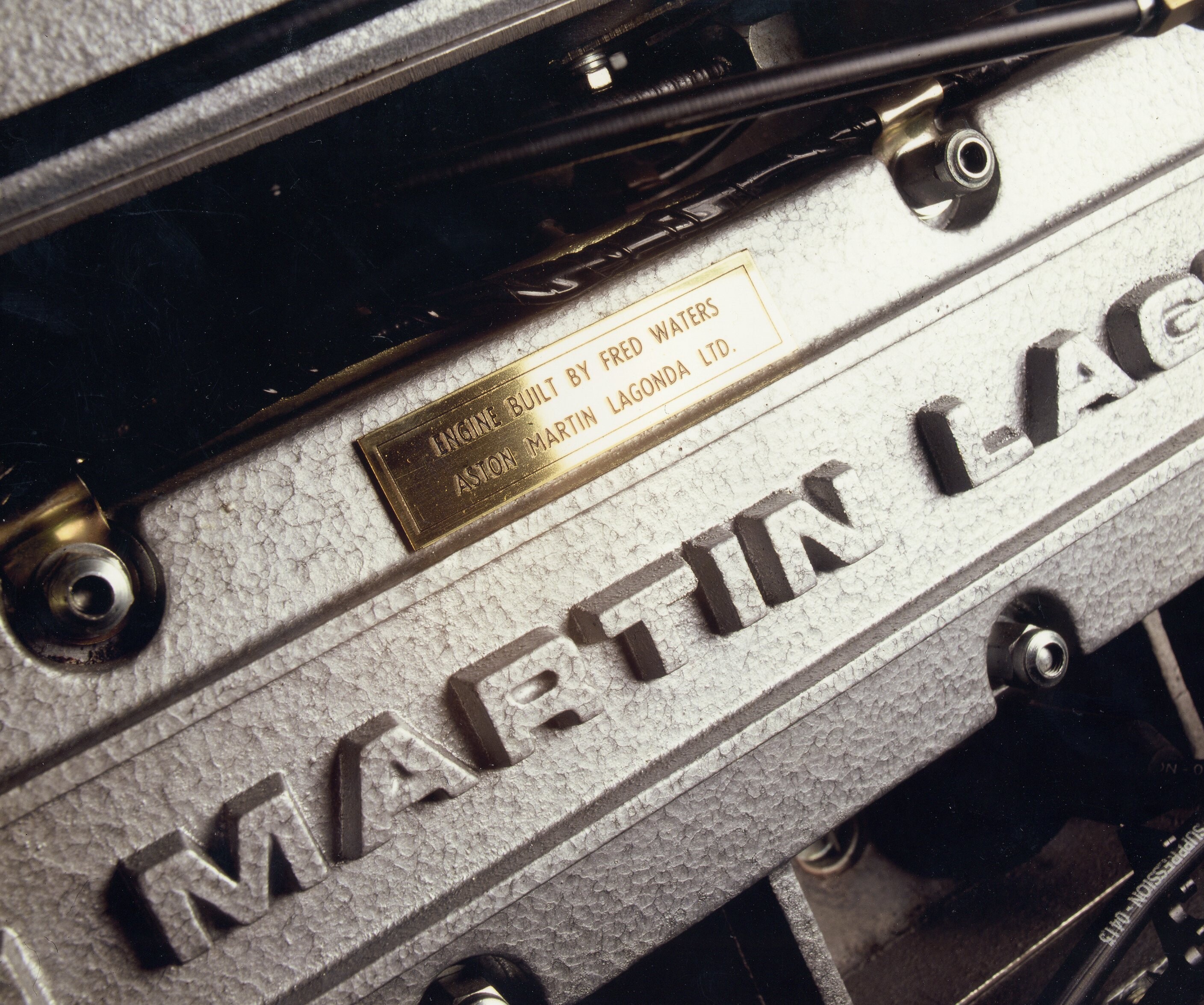 Details of the V8 Vantage Volante, showing the interiors, the engine and the front and rear of the car