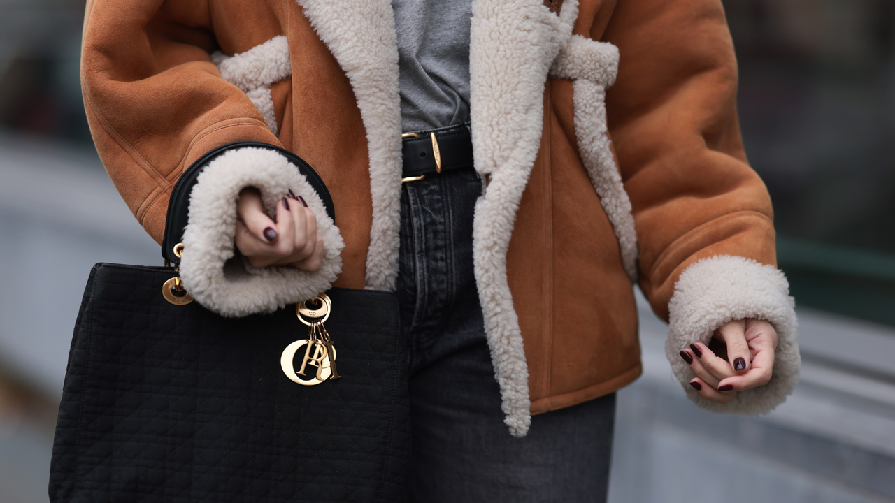 Sparkling Merlot Nails on woman at fashion week 