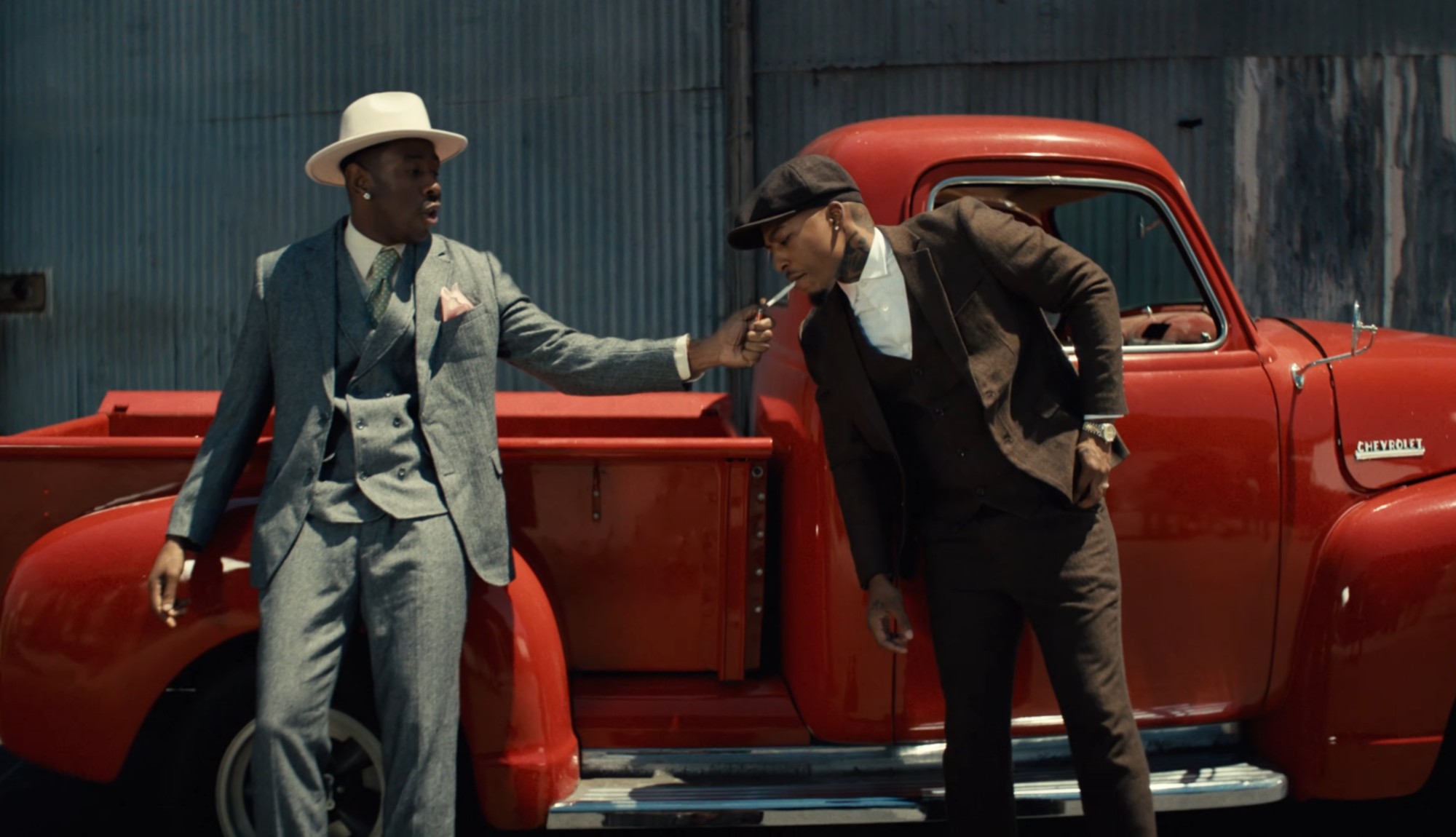 (From L to R) Artists Tyler the Creator and AZ Chike dressed as twins Smoke and Stack from Ryan Coogler's "Sinners" in the new Look Like My Mama music video. 