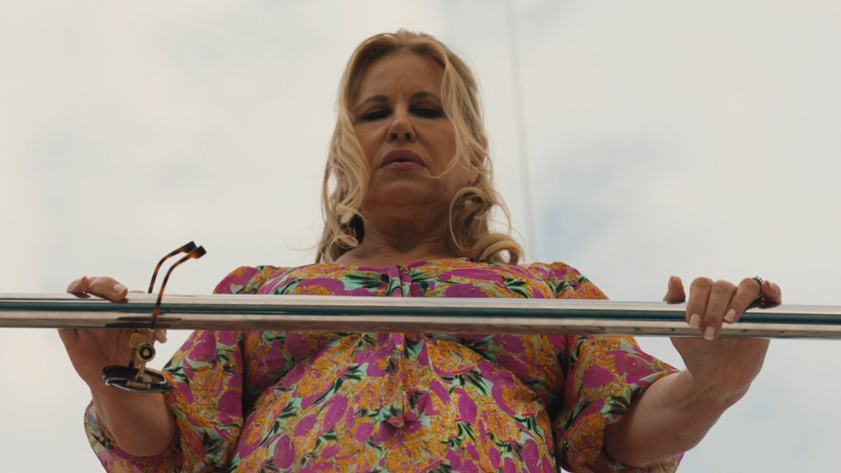 Tanya looking over boat railing on The White Lotus