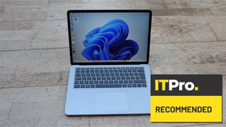 A photograph of the Microsoft Surface Studio Laptop overlaid with the IT Pro Recommended award logo