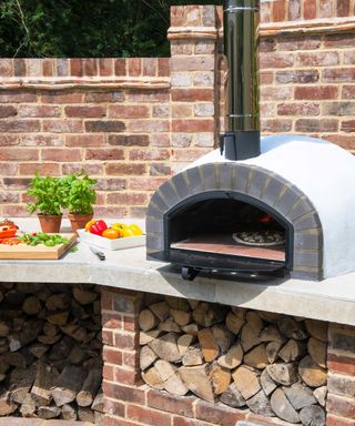 built in domed pizza oven in an outdoor kitchen