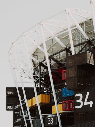 stadium made from old shipping containers
