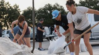 Residents fill sandbags at Helen Howarth Park in Pinellas Park, Florida, fill sandbags ahead of Hurricane Helene's arrival.