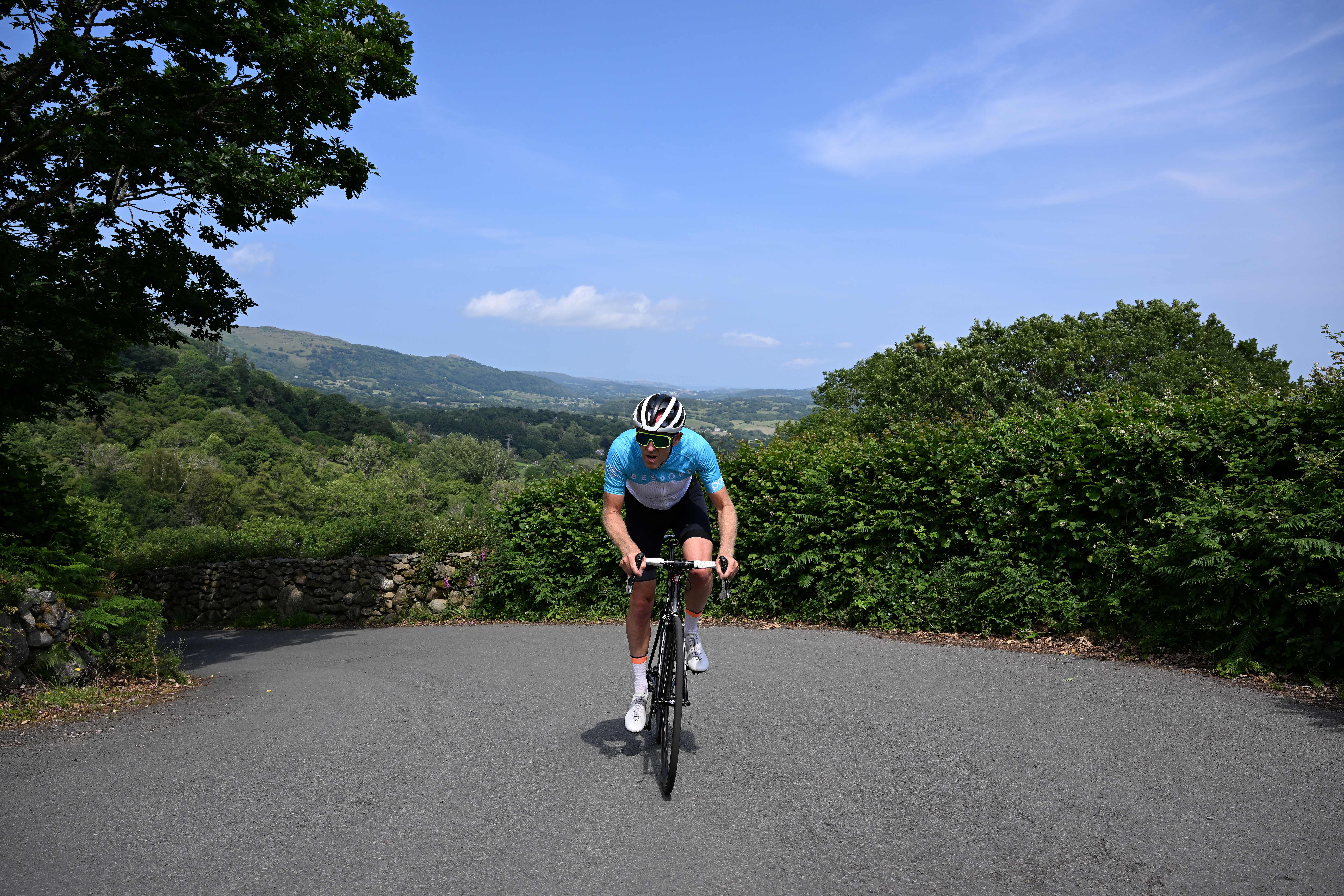 Man cycles up hill