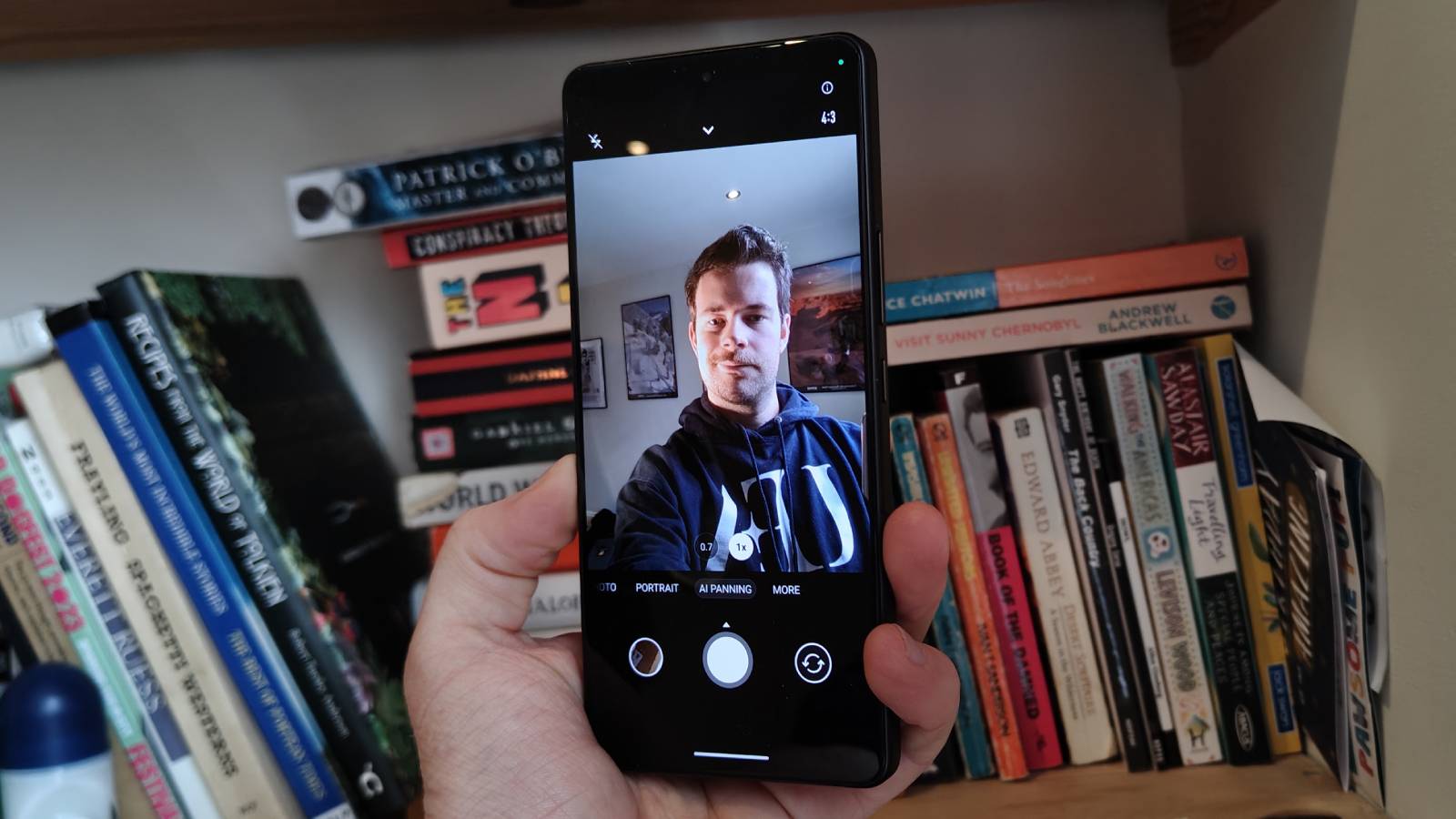 The Asus Zenfone 12 Ultra on a bookshelf.