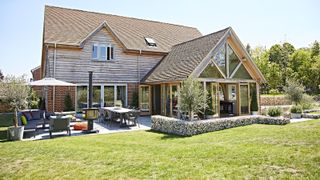 A lawn at the front of a house in sunshine