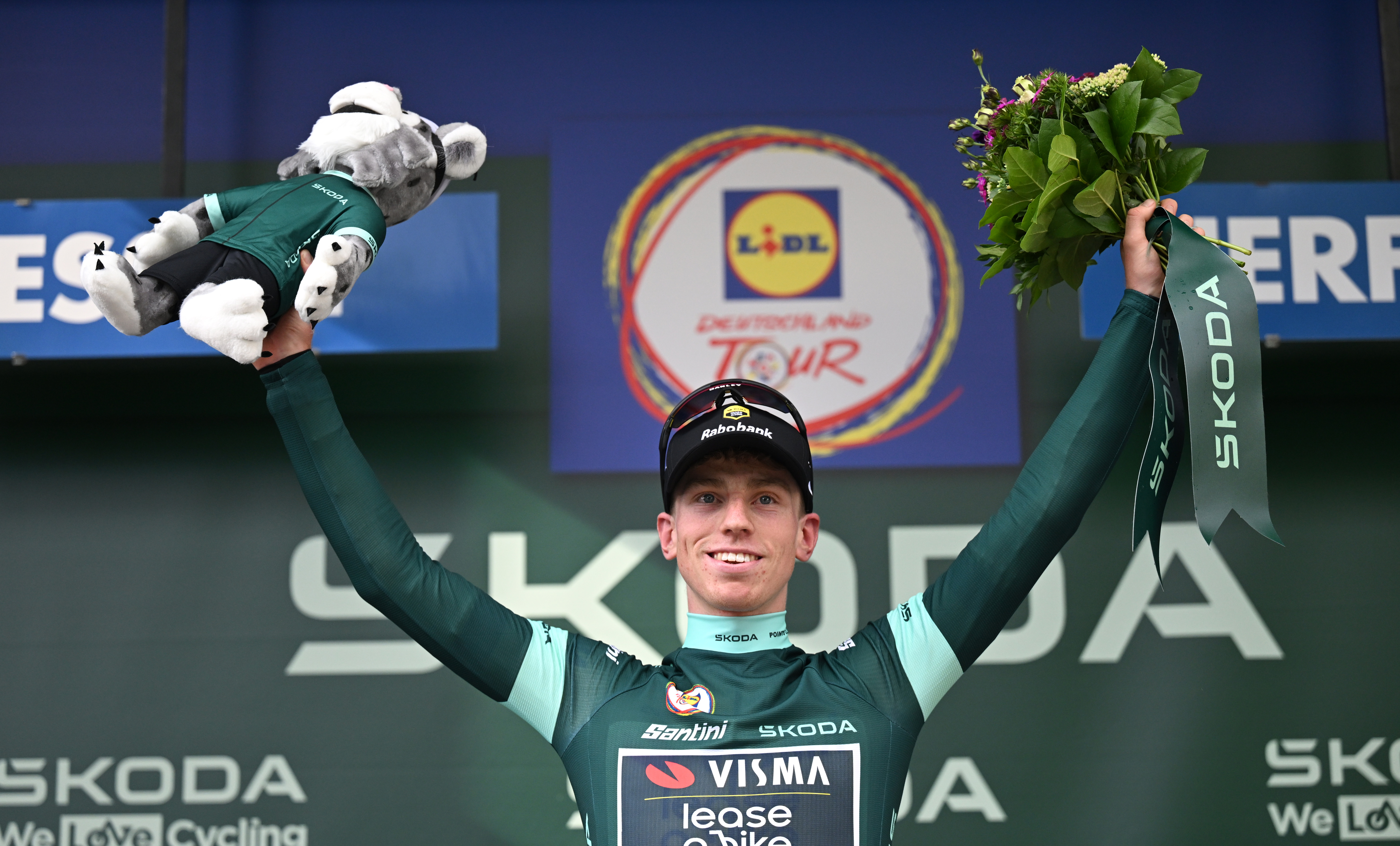 Matthew Brennan in the green jersey on stage at the Deutschland Tour