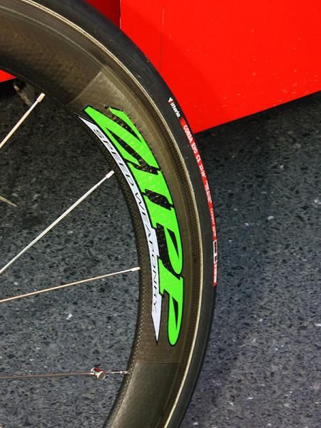 Zipp decorates Hushovd's 404 and 808 carbon tubulars with bright green decals.