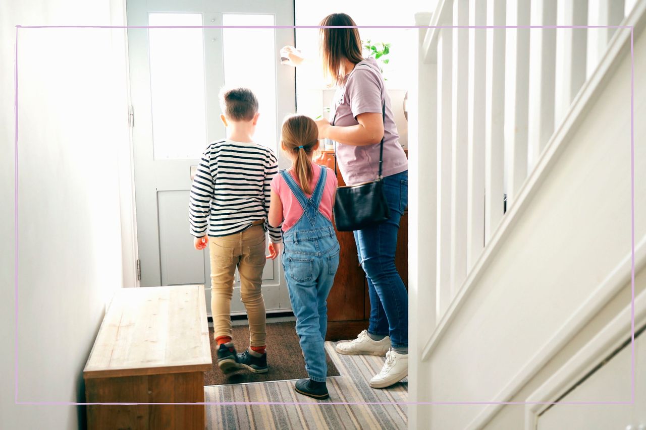 Mother hurrying her children out of the door