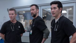 From left to right: Shawn Hatosy as Abbot, Noah Wyle as Robby and Ken Kirby as Shen, all looking forward with concerned looks. 