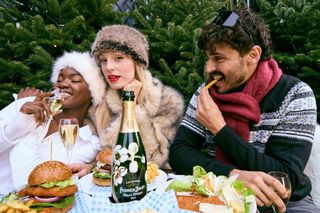 group shot of people enjoying champagne in winter outfits