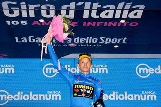 LAVARONE ITALY MAY 25 Koen Bouwman of Netherlands and Team Jumbo Visma celebrates winning the blue mountain jersey on the podium ceremony after the 105th Giro dItalia 2022 Stage 17 a 168 km stage from Ponte di Legno to Lavarone 1161m Giro WorldTour on May 25 2022 in Lavarone Italy Photo by Tim de WaeleGetty Images
