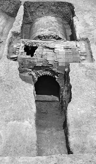 A brick tomb from the Ming Dynasty held gold treasures and the skeletal remains of a woman named Lady Mei. The tomb, with its vaulted roof, was excavated in 2008.