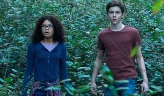 A Wrinkle In Time Storm Reid Levi Miller standing in the woods