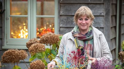 Garden expert Sarah Raven in an autumnal garden